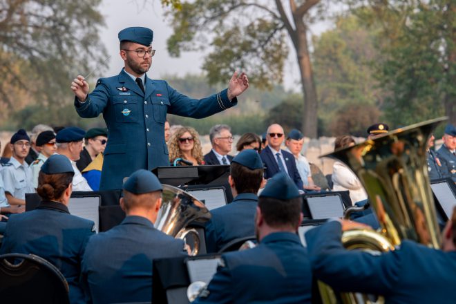 Commanding Officer of the Royal Canadian Air Force Band, Devin Sloos conducts a symphony, commemorating the 80th anniversary of D-Day, honouring all who served, and to celebrate Winnipeg’s 150th, and the Royal Canadian Airforce’s 100th Anniversary on September 10th, 2024 at the Brookside Candlelight Service at Brookside Cemetery, Winnipeg, Manitoba.

Photo: Private Joshua Schultz, 17 Operation Support Squadron Imaging (Winnipeg)